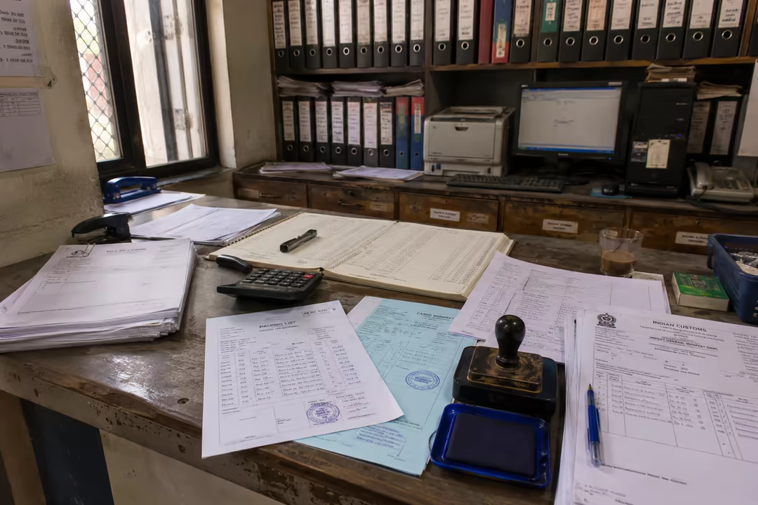 Bill of lading and customs paperwork on a desk