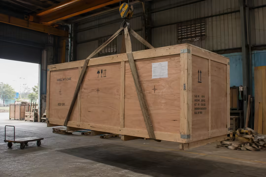 Industrial cargo crate under a crane hook