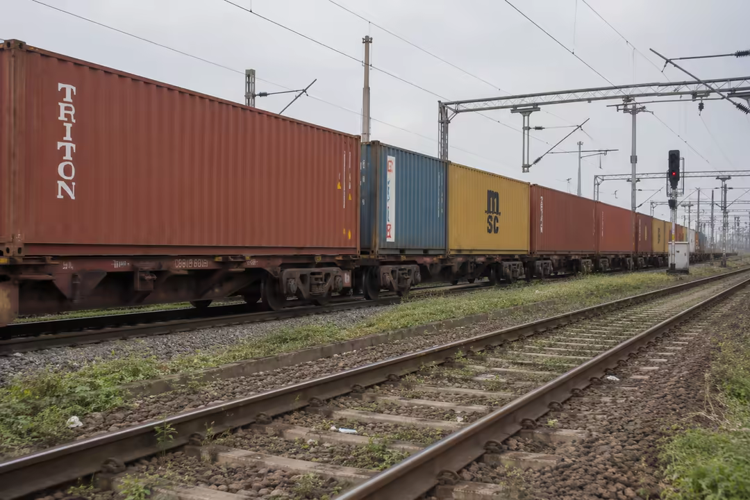 Container flat wagons on the rail link out of the terminal