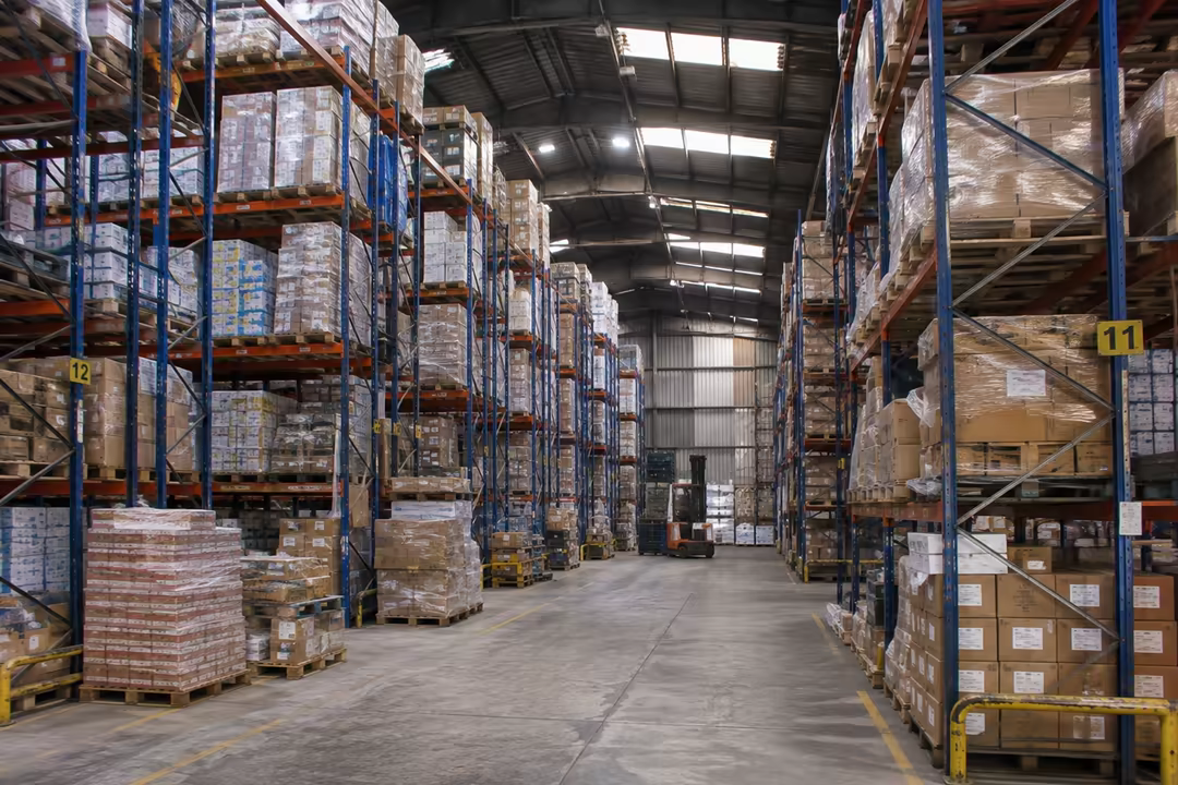 Warehouse racking stacked with palletised goods